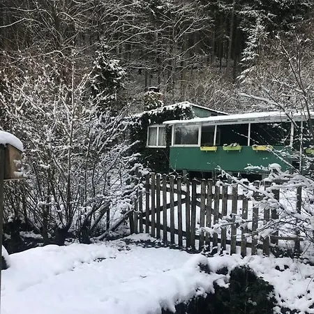 Lonely Mountain Hut On The Stream Edge